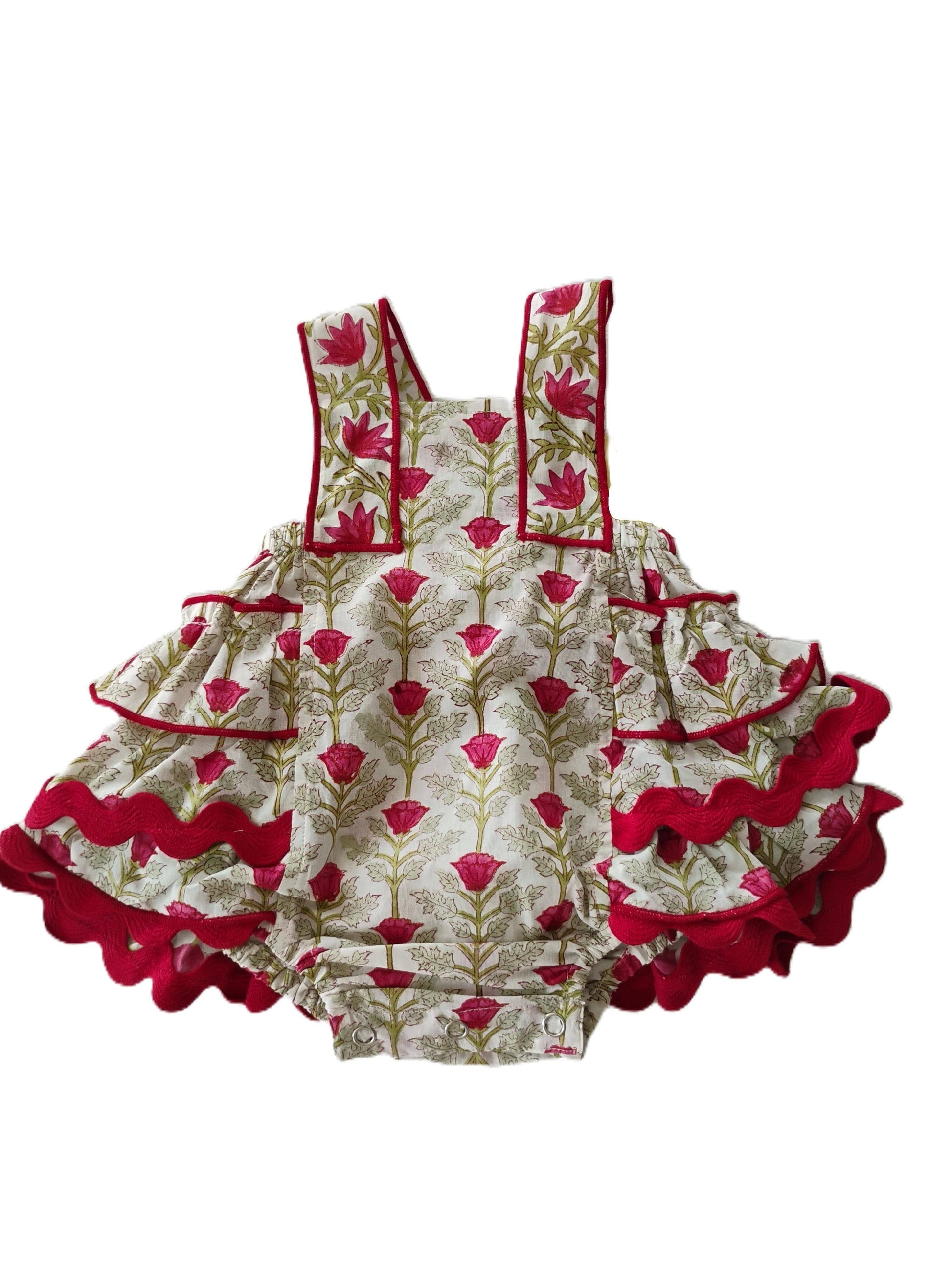Children's dress with floral pattern and red accents on a white background