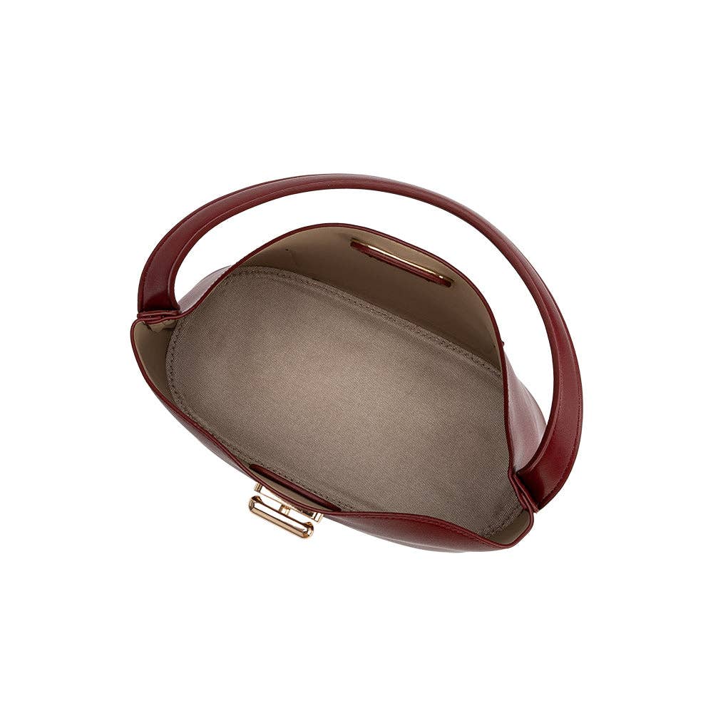 A top-down view of a burgundy leather handbag with a curved top handle and gold-tone hardware, shown against a plain white background.