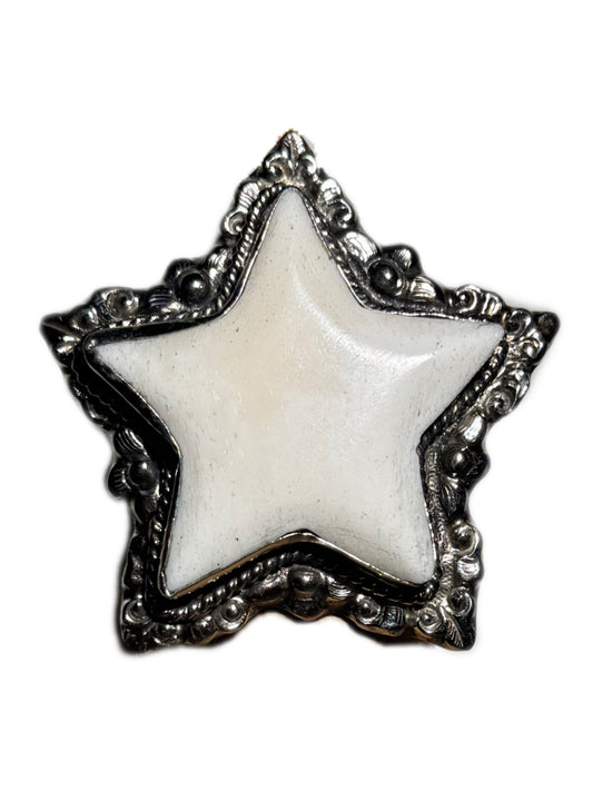 Star-shaped ring with white center and silver decorative border on a white background