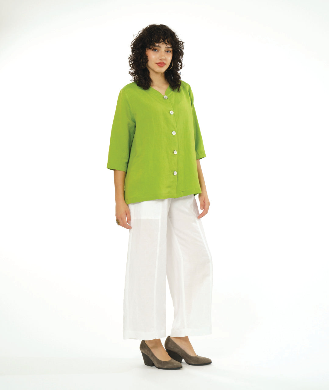 model in a wide leg white pant with a lime button down blouse with a 3/4 sleeve 