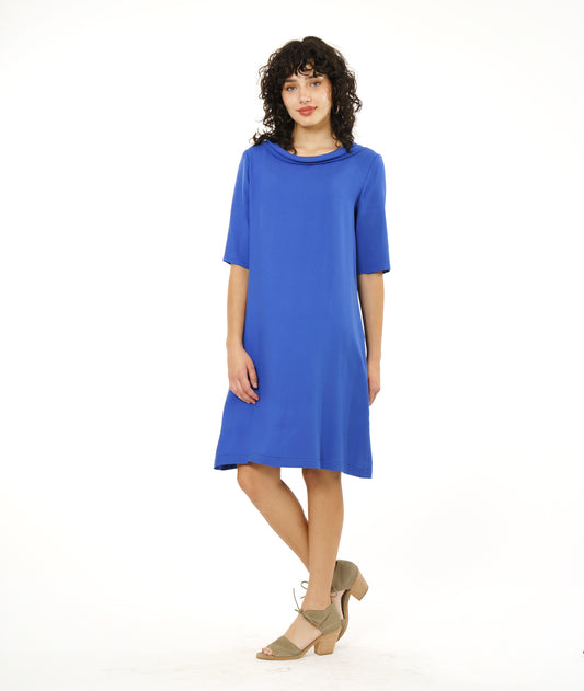 model in a knee length periwinkle shift dress with a 3/4 sleeve and a cowl neckline