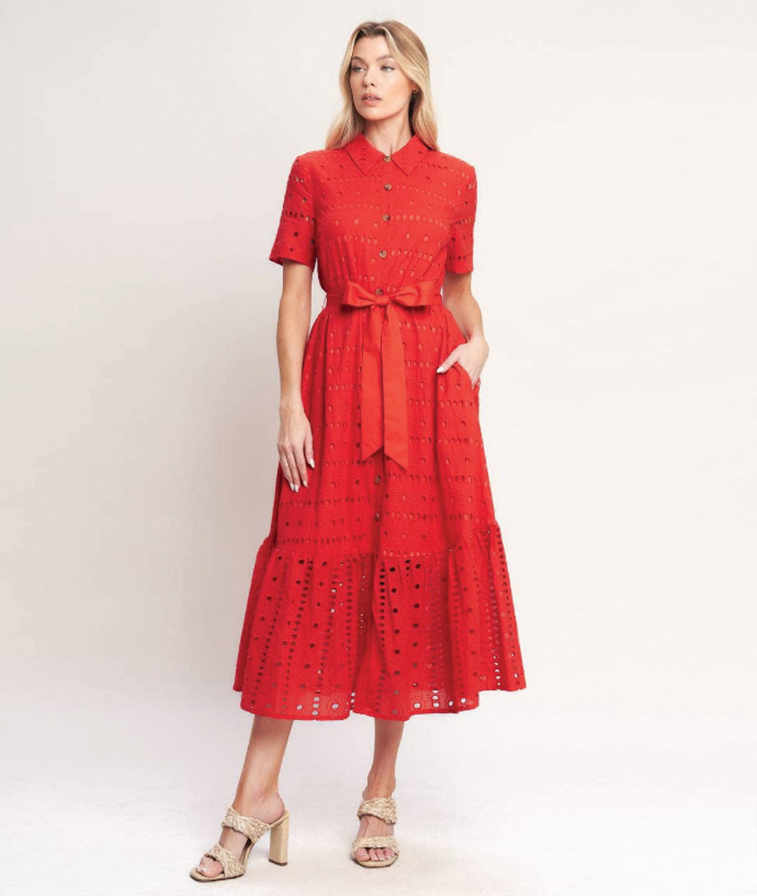 Woman wearing a red dress with a white background