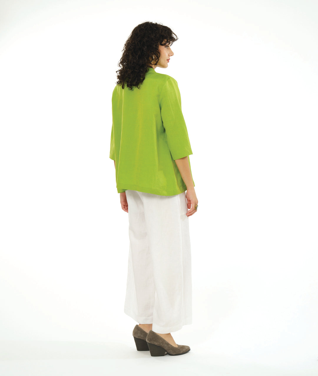 model in a wide leg white pant with a lime button down blouse with a 3/4 sleeve 