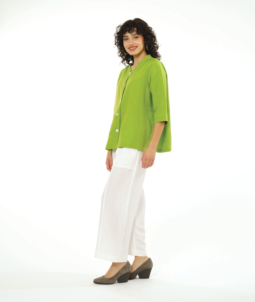 model in a wide leg white pant with a lime button down blouse with a 3/4 sleeve 