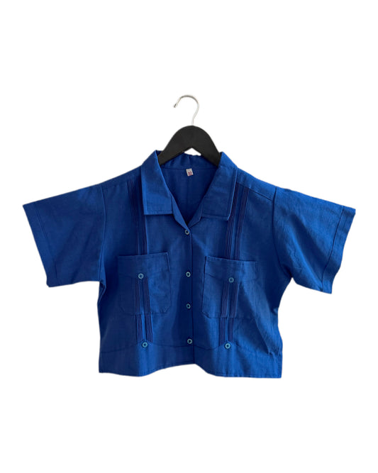 Blue shirt on a hanger against a white background