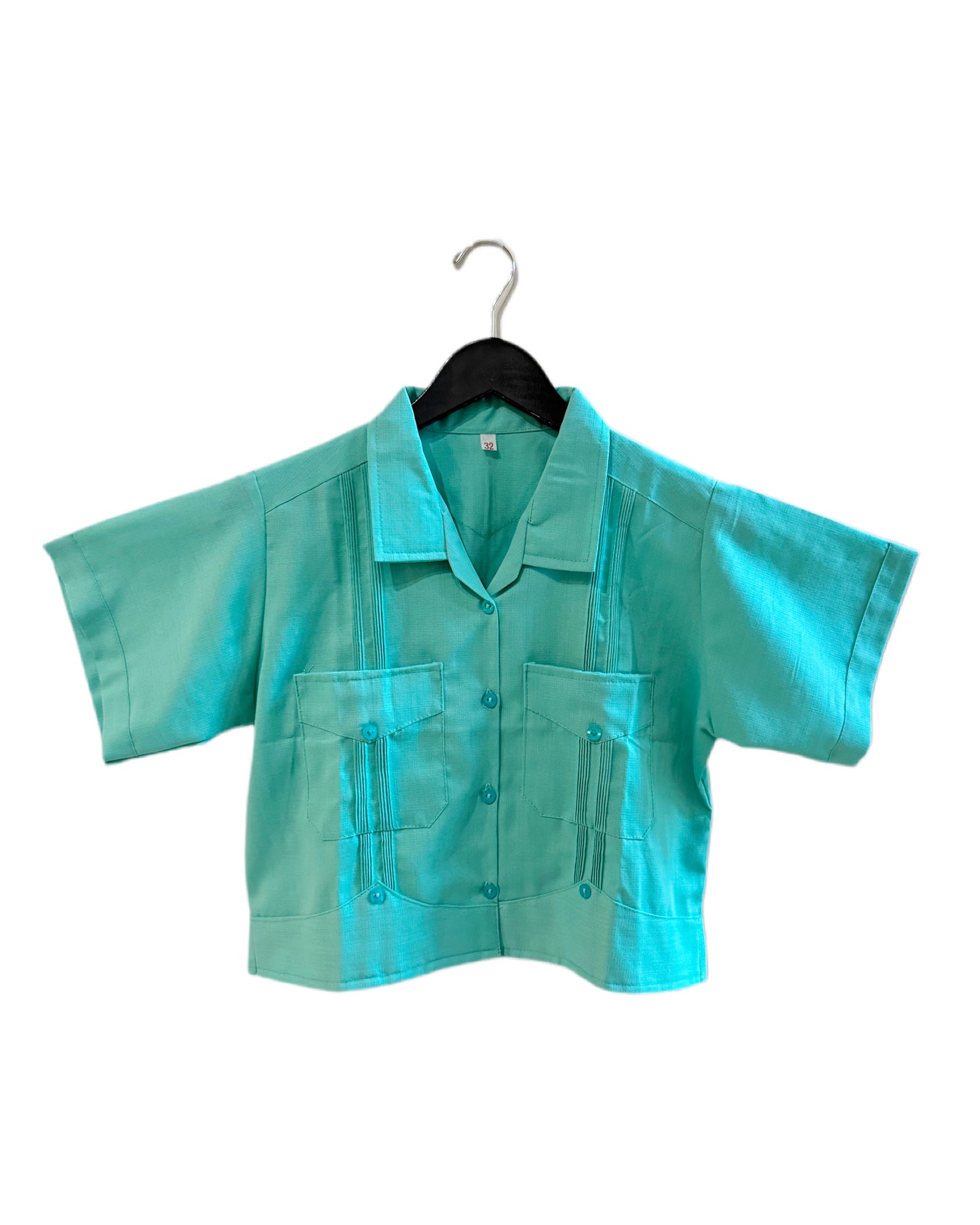 Turquoise shirt on a hanger against a white background
