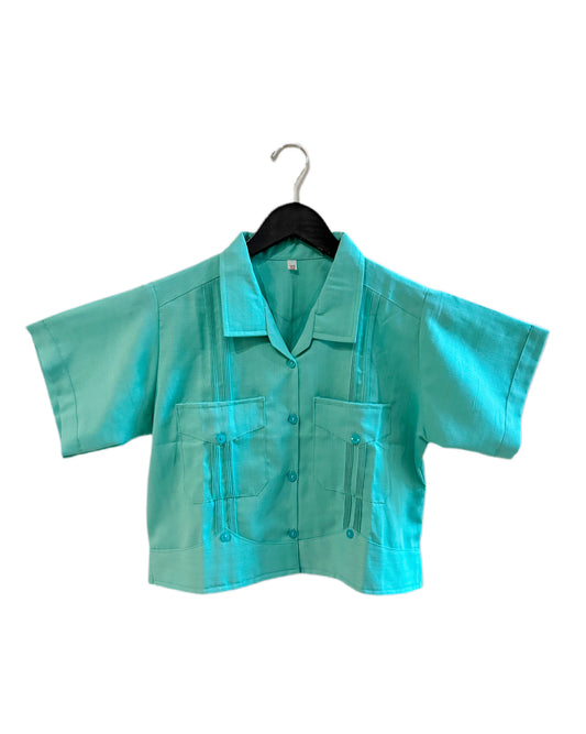 Turquoise shirt on a hanger against a white background