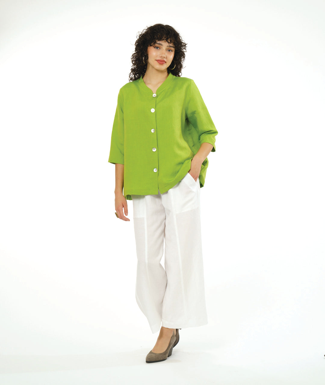 model in a wide leg white pant with a lime button down blouse with a 3/4 sleeve 