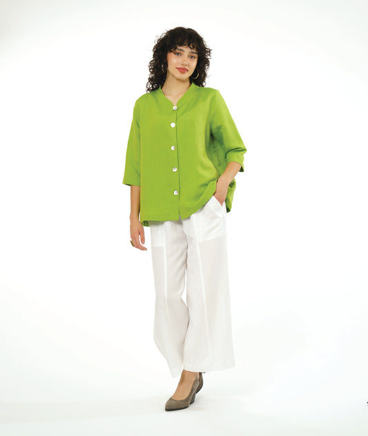 model in a wide leg white pant with a lime button down blouse with a 3/4 sleeve 