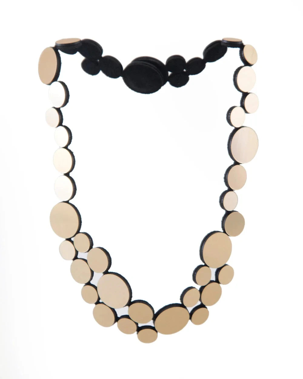 Gold circle cluster necklace against white background