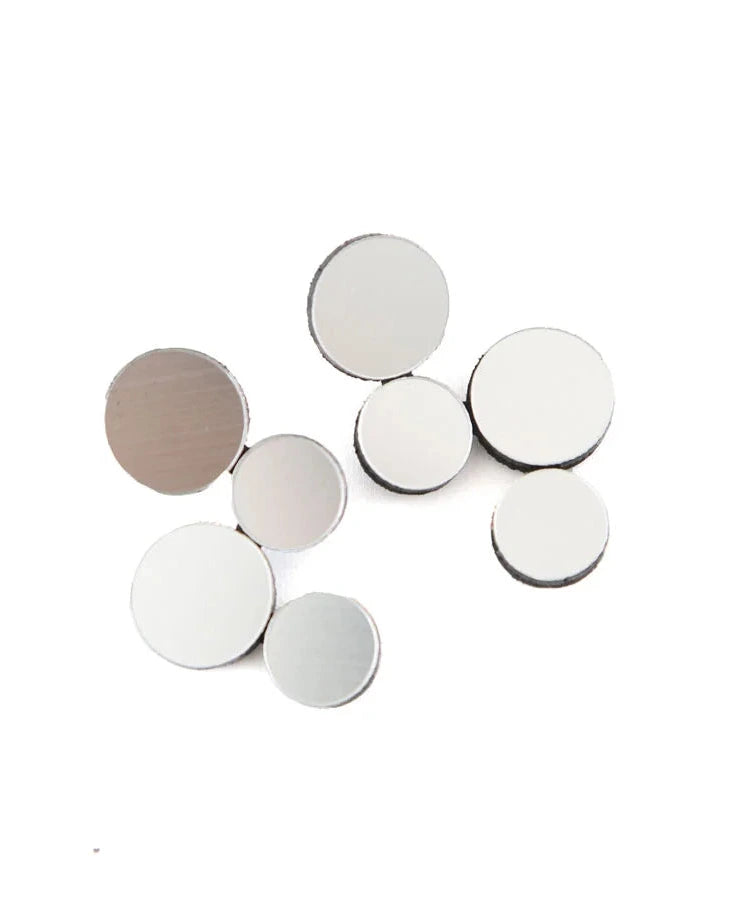 Silver circle cluster earrings against white background