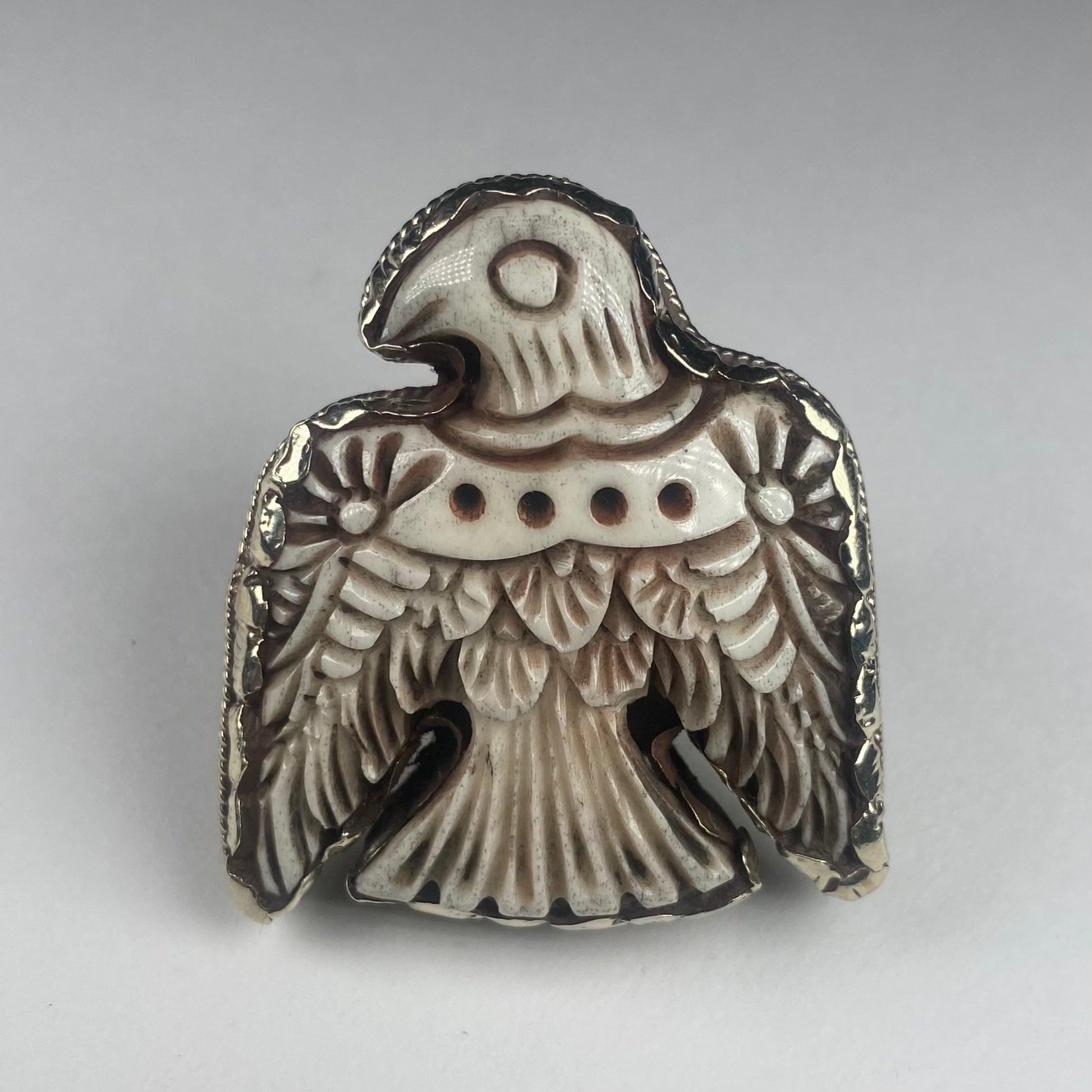 Engraved thunderbird ring  in cattle bone.