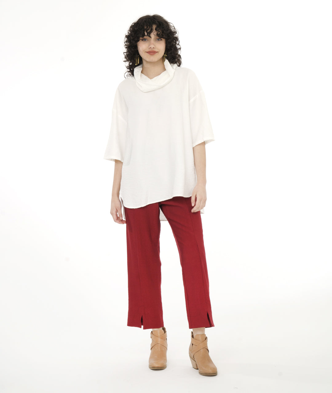 model in a straight leg red pant with a boxy cowl neck top