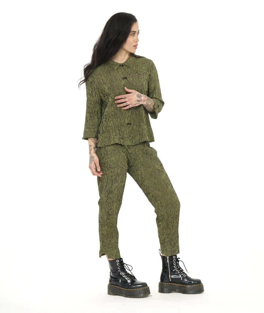 model wearing green striped long sleeve top with green striped tapered pants