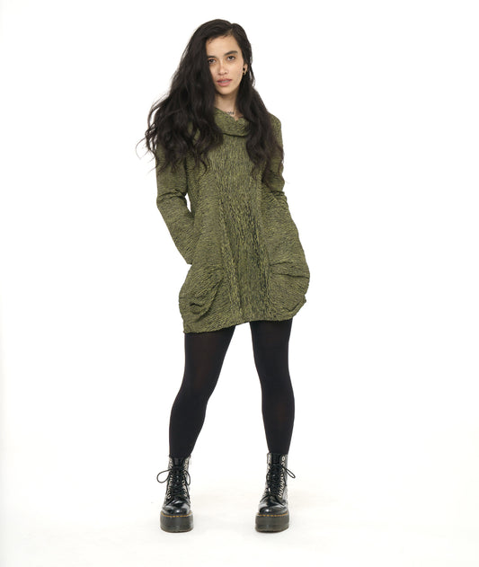 model in a green and black striped tunic with princess seams, a large cowl neck, long sleeves and pleating at the hips