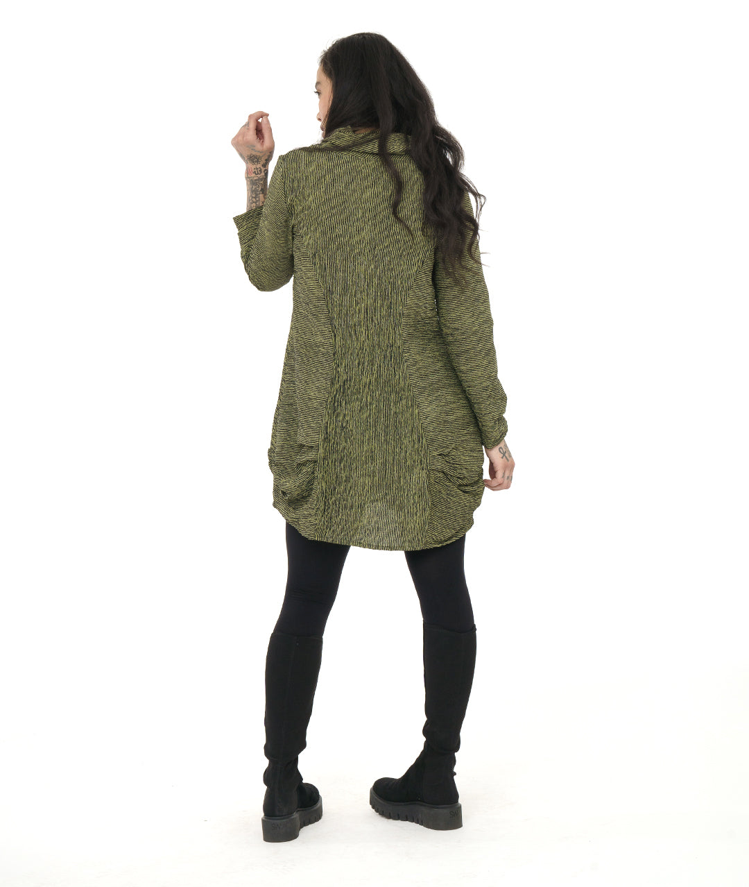 model in a green and black striped tunic with princess seams, a large cowl neck, long sleeves and pleating at the hips