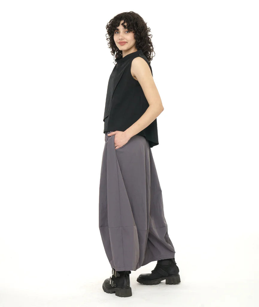 model wearing black tank and fog color wide leg pants