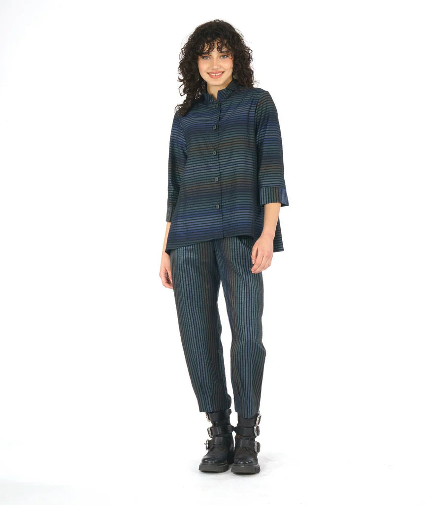 model wearing a striped dark blue long sleeve top with matching pants on a white background