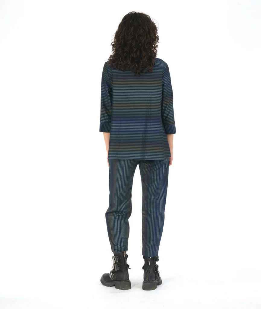 model showing back of striped dark blue long sleeve top with matching pants on a white background