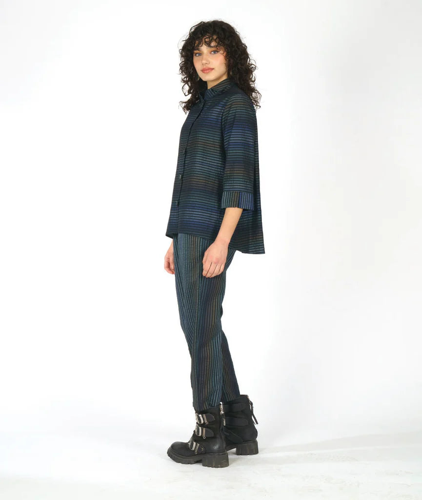 model wearing a striped dark blue long sleeve top with matching pants on a white background
