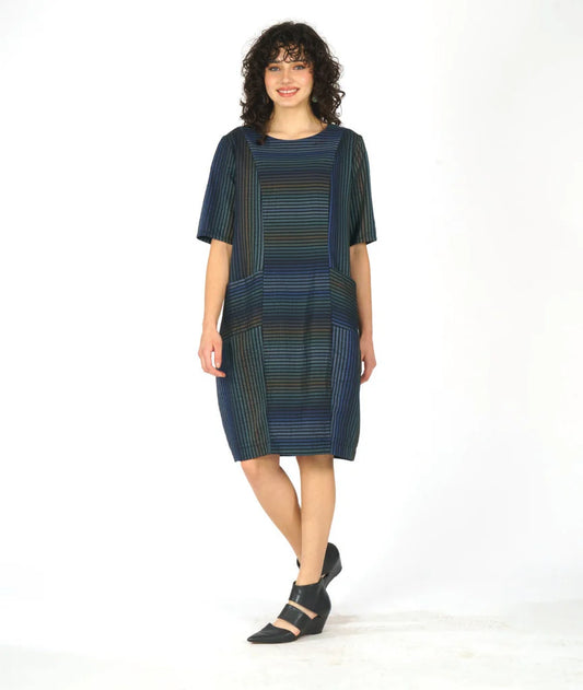 model wearing a striped half sleeve dress with two front pockets on a white background