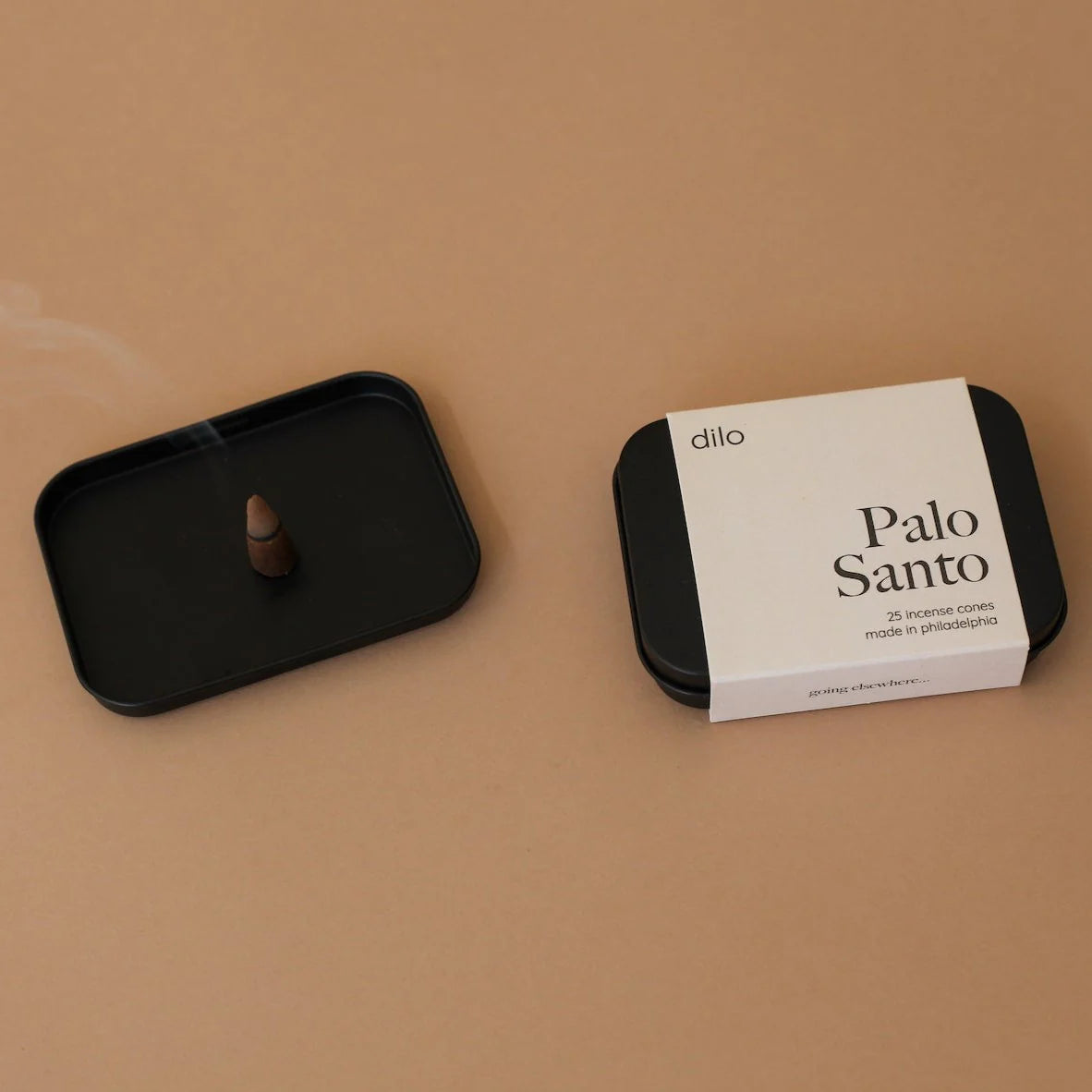 palo santo scented incense cone packaging with lit cone