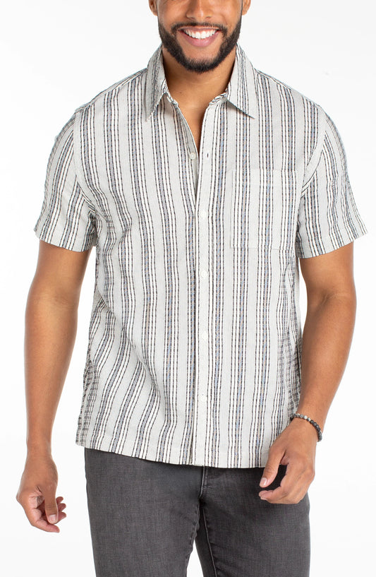 Man wearing a striped short-sleeve shirt on a white background