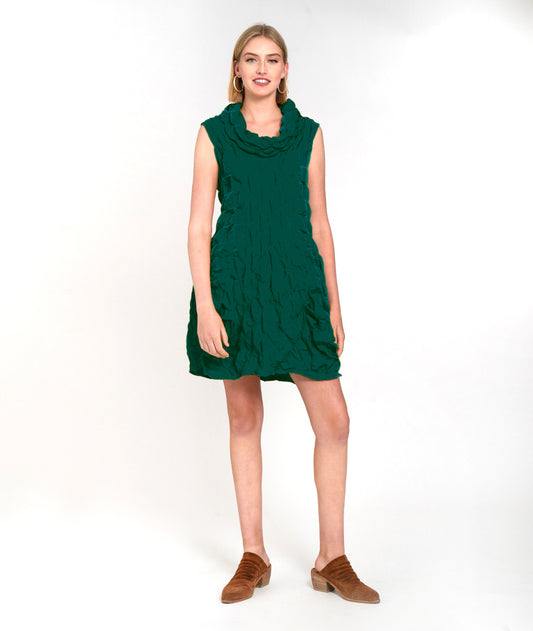 model in an emerald green sleeveless tunic with a large cowl neck, princess seams, and full tucks at the hips