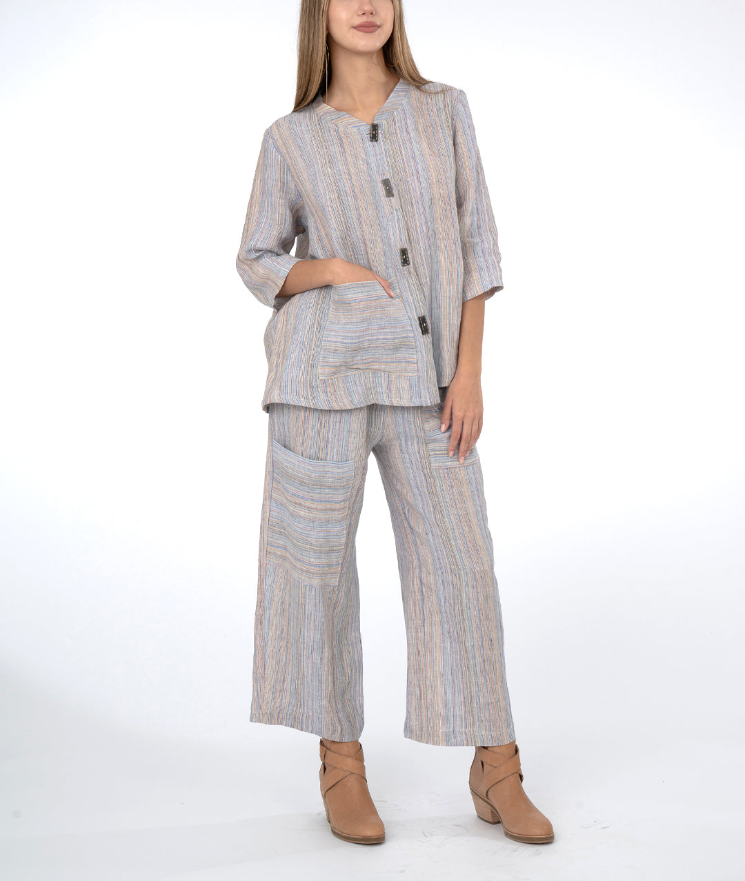 model in multi color striped wide leg pant with a matching botton down top