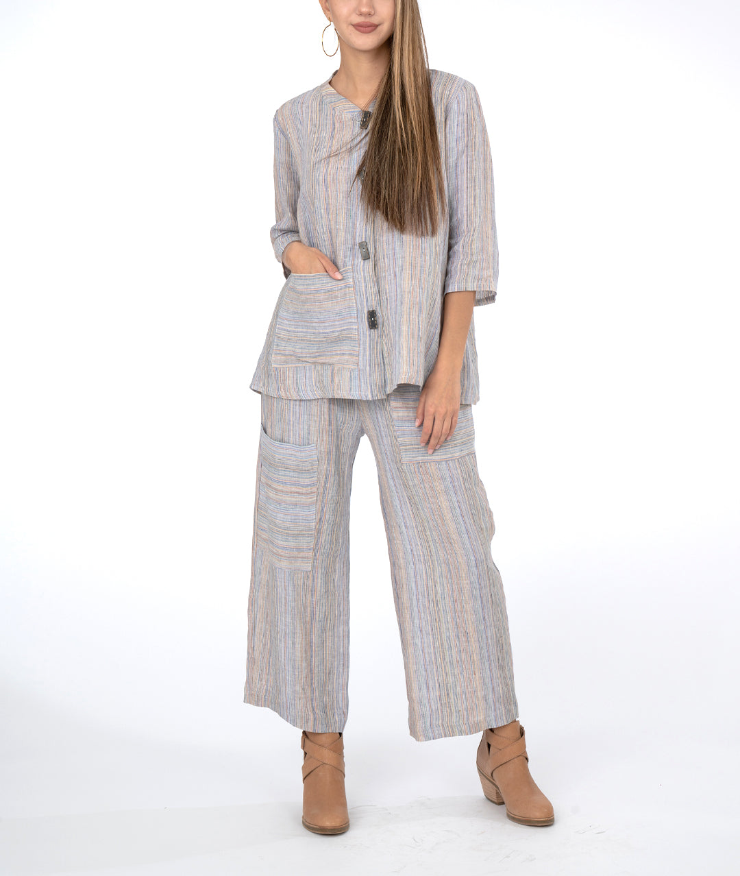 model in multi color striped wide leg pant with a matching botton down top