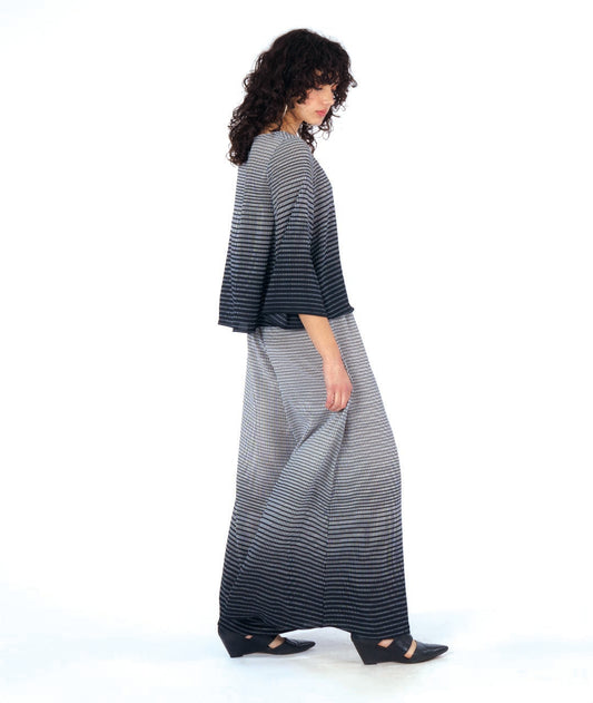 model in a wide leg pant with a matching boxy top, both in a black and white gradiant print