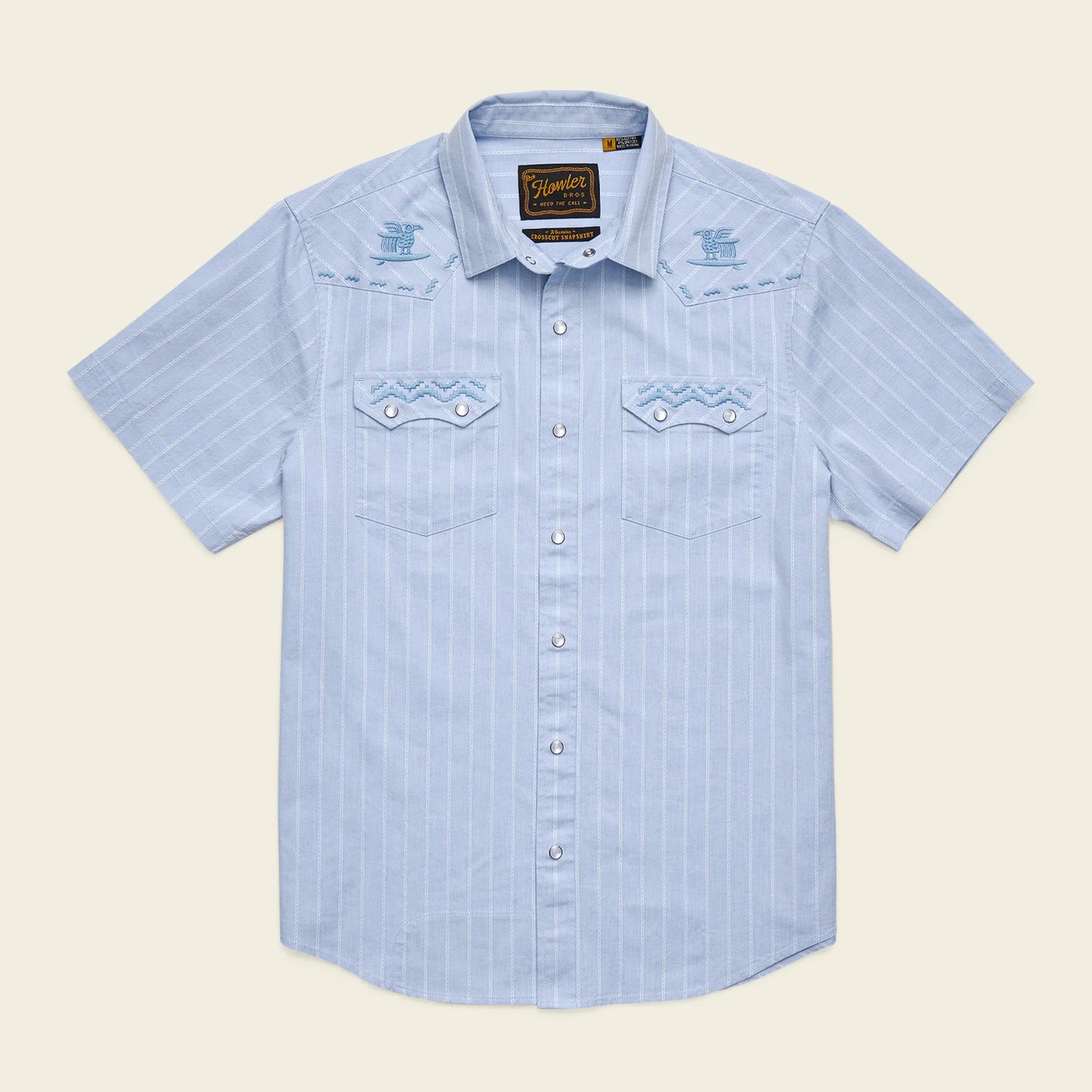 blue pearl snap short sleeve shirt with stripe pattern and embroidery on white background