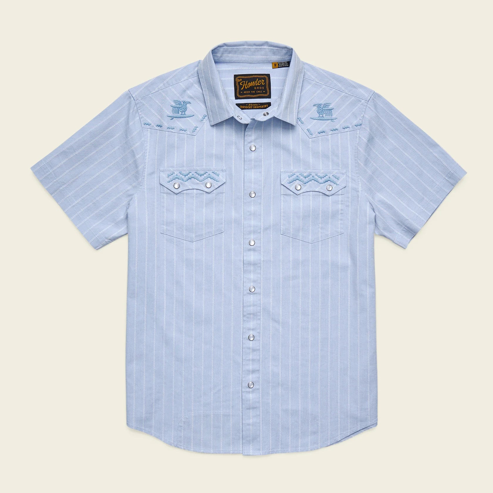 blue pearl snap short sleeve shirt with stripe pattern and embroidery on white background