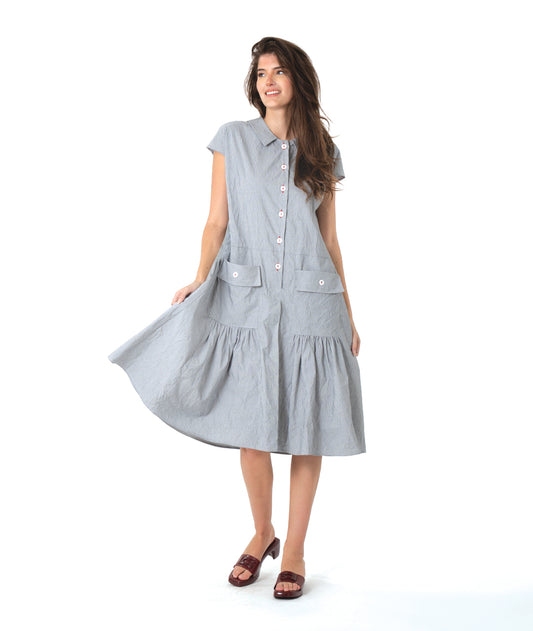 grey and white pinstriped button down dress with a dropped waist, cap sleeves, squared hip pockets and contrasted red stitching at the buttons.