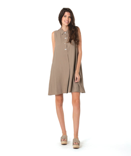 Woman wearing a taupe brown sleeveless shirt dress on a white background