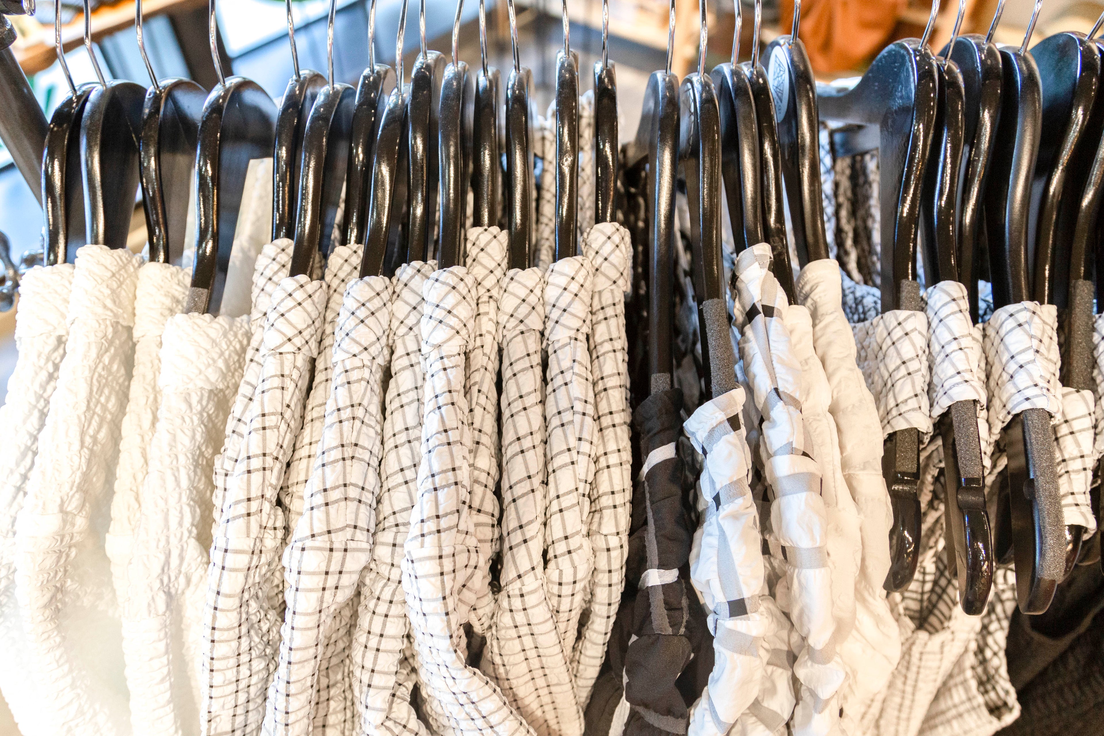 rack of black and white clothing