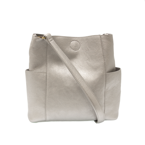 silver vegan leather bag with pockets on each side and shoulder strap