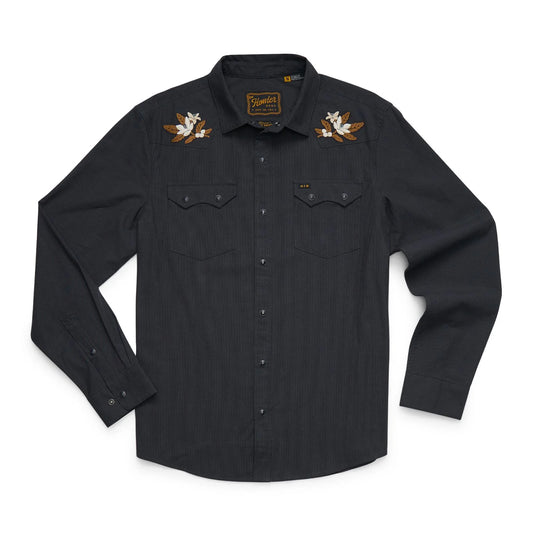 A black long-sleeve button-up shirt featuring embroidery on both shoulders and a small logo patch on the left chest pocket flap, displayed flat against a white background.