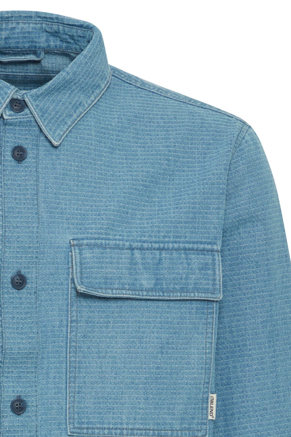 close up of baby blue ripstop long sleeve collared shirt with two large pockets and navy blue buttons