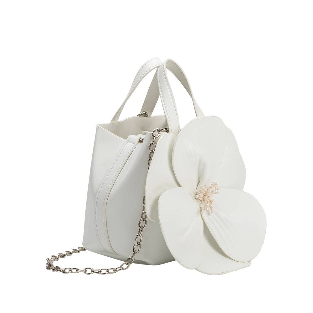 side view of white handbag with large 3d flower and chain crossbody