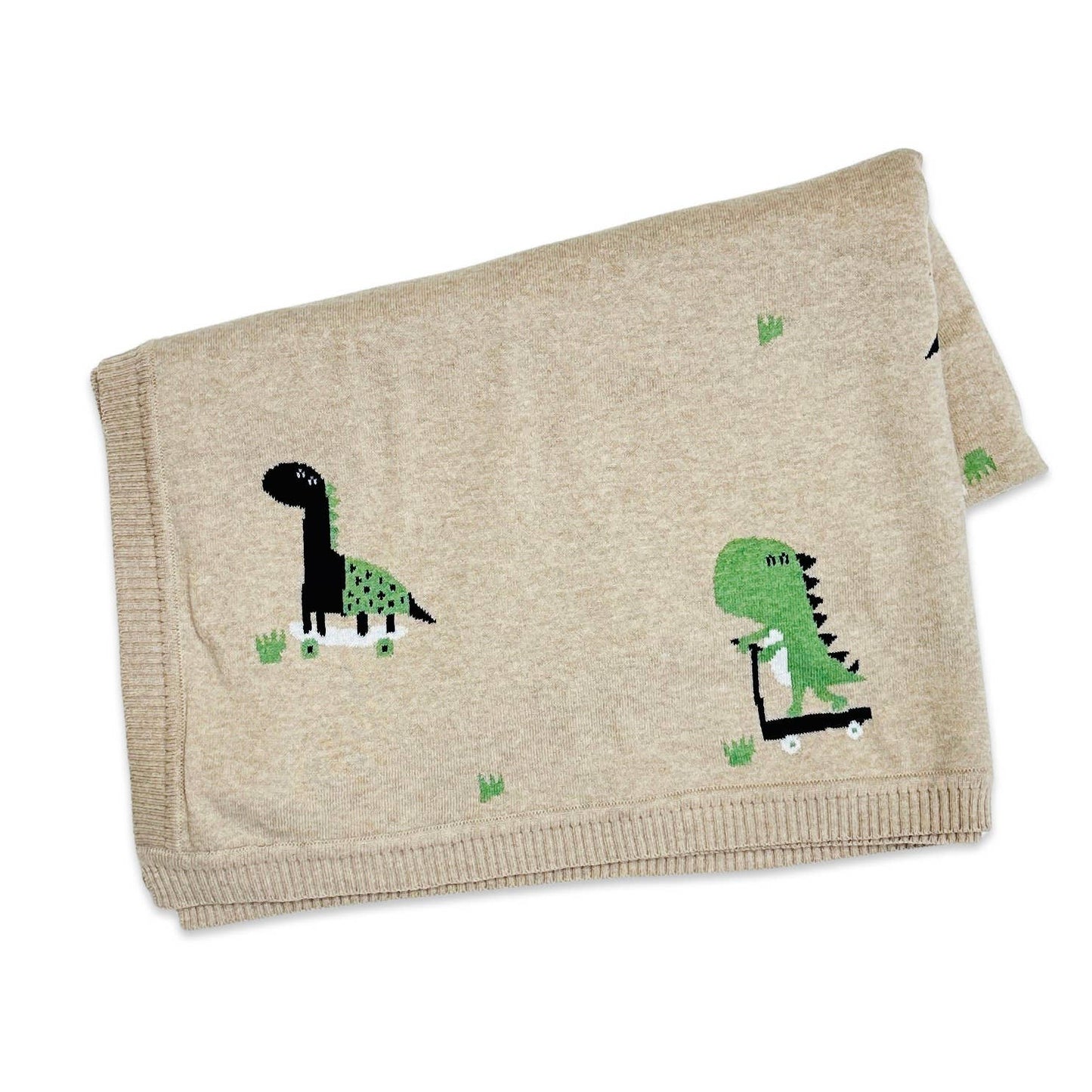 knit baby blanket in tan heather color with images of dinosaurs on skateboards