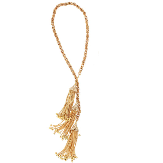 Gold necklace with tassels on a white background