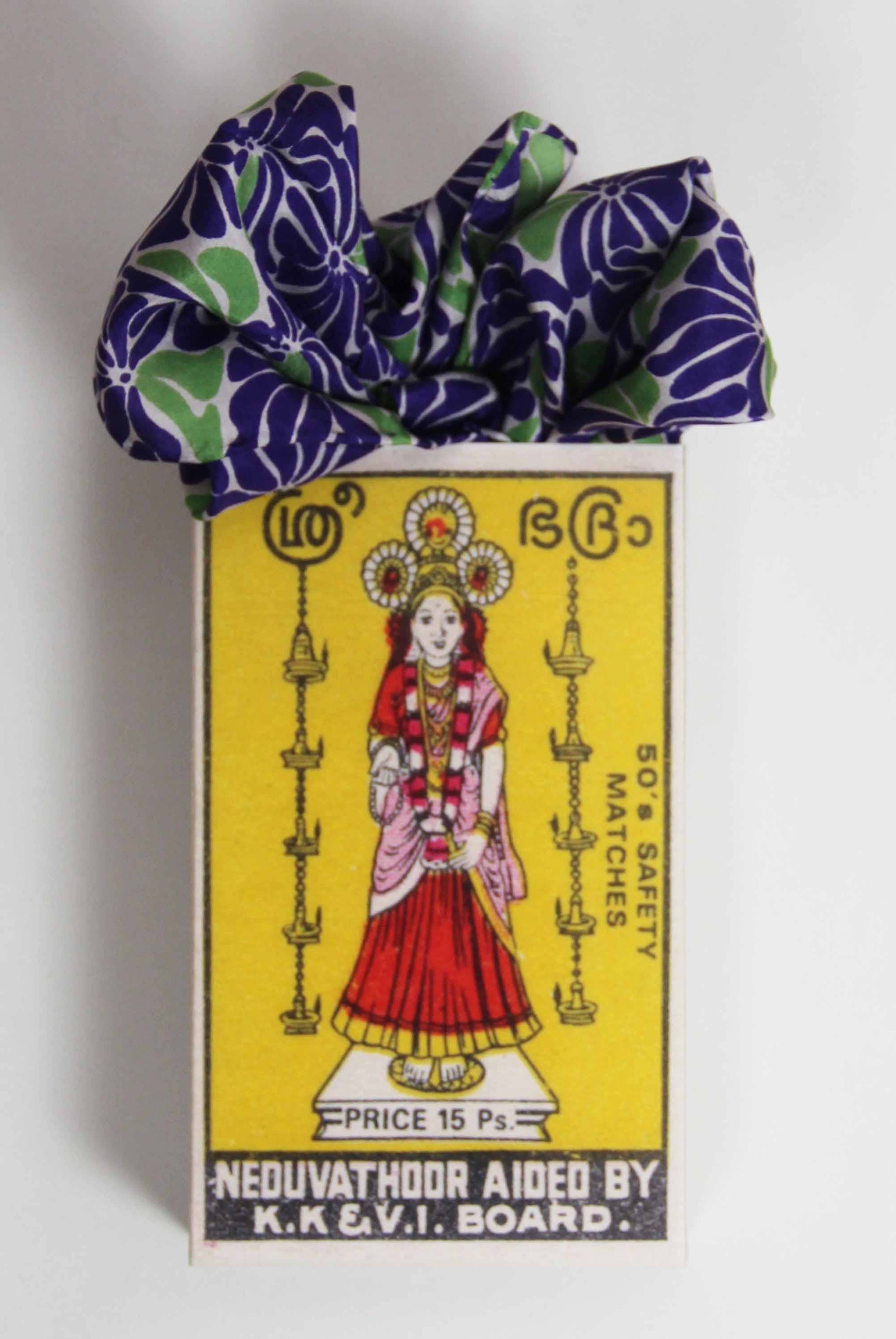 Matchbox with a colorful design and text on a white background