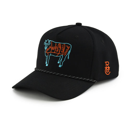 Black cap with blue cow illustration and orange logo on a white background