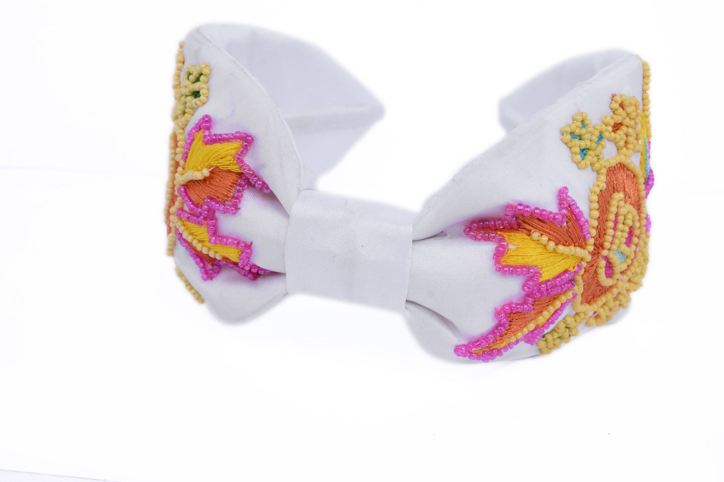 white headband with floral embellishing