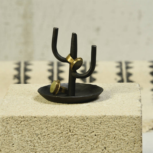 black iron cactus ring holder holding two rings