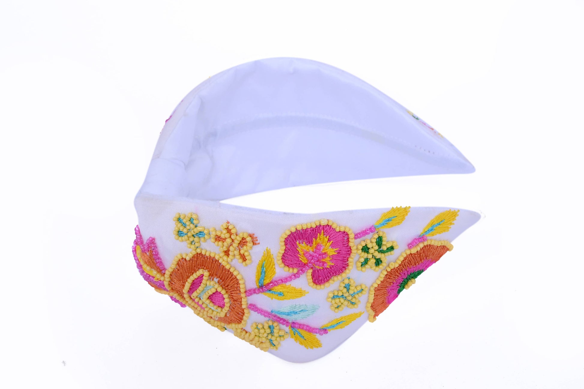white headband with floral embellishing