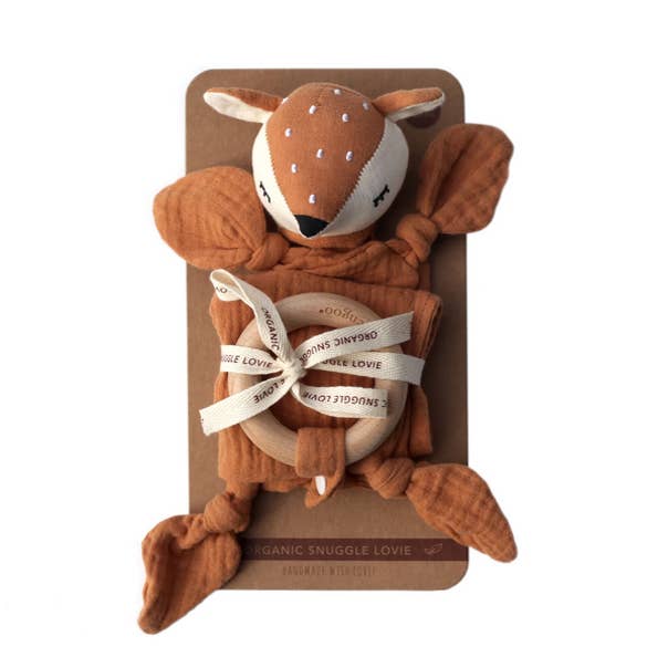 Brown plush fawn toy with a white ribbon on a brown card