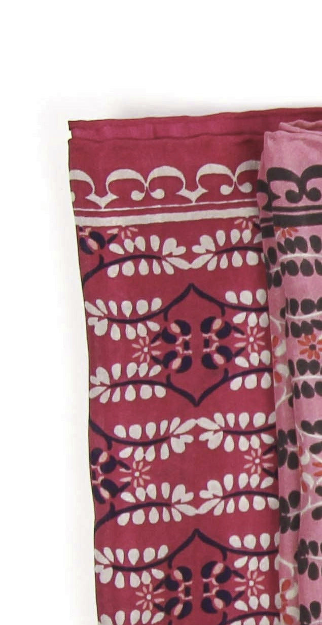 Set of colorful patterned scarves arranged in a row on a white background