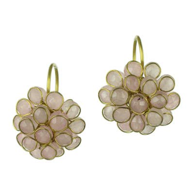 Faceted rose quartz flower dangle earrings in brass on white background